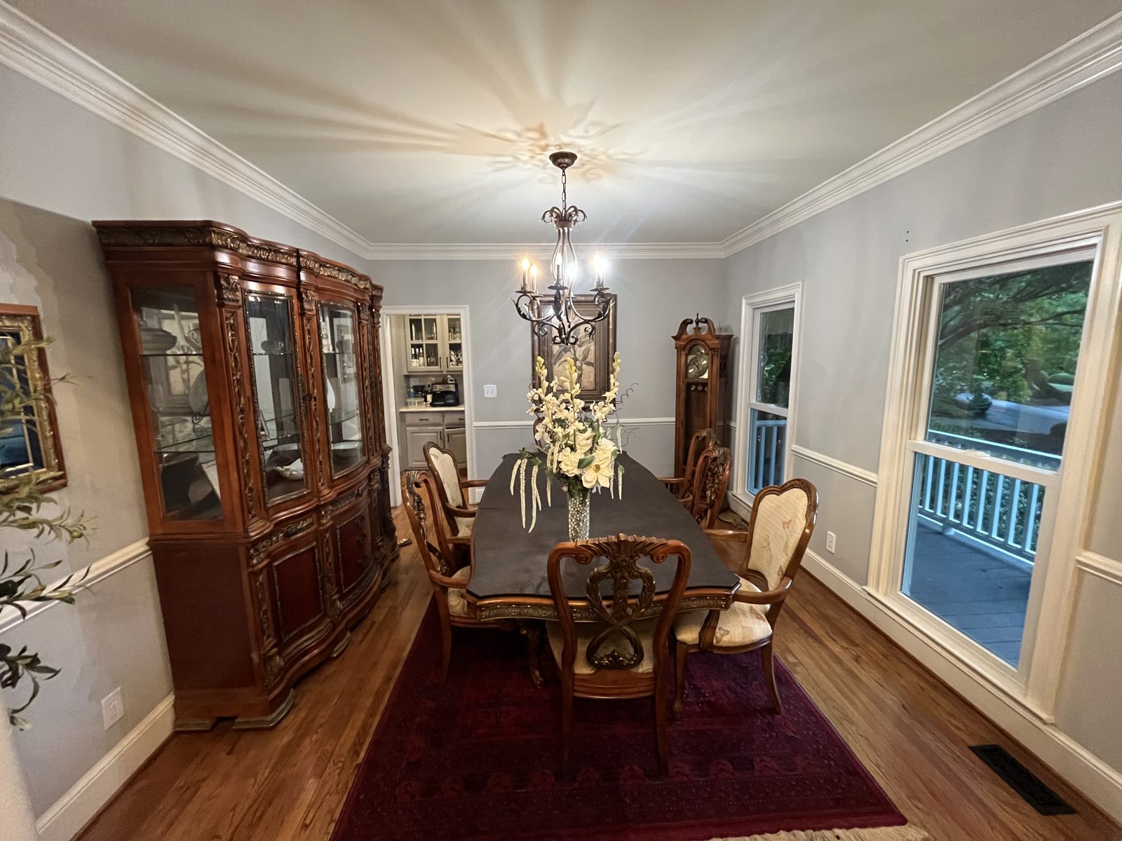 Dining room with a long table before painting
