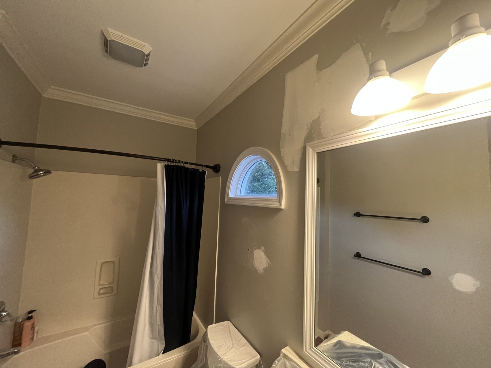 The same bathroom with wall patches during prep