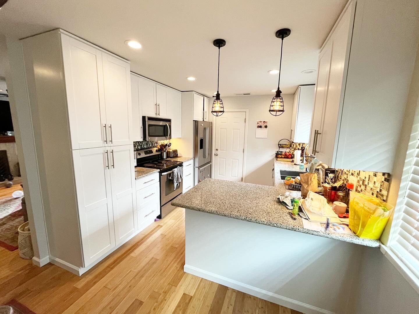 The same kitchen with the cabinets painted white